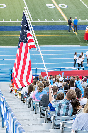 Students gather at the stadium to watch the football championship.