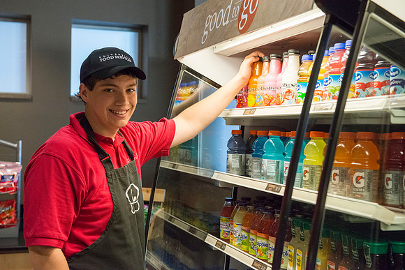 Stocking the shelves in the Good to Go section of the Crossroads Foodcourt.