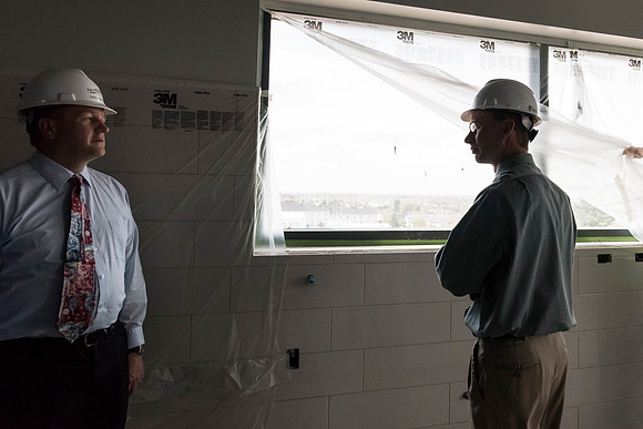 Faculty Members tour the new science building while it is still under construction.