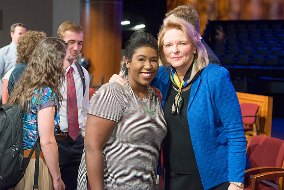 Sheri Dew speaks at devotional and gives out lots of hugs and greetings afterwards.