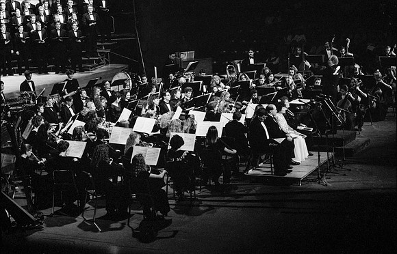 Sacred Music Series: Visions of Eternity. Orchestra members play a piece for the performance. Performance held in the Hart Auditorium of Ricks College.