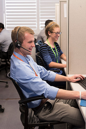Employees work on developing a better curriculum for online students.