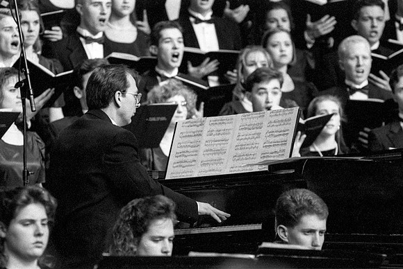 The pianist playing with the choir and orchestra