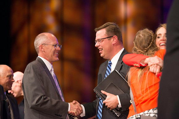 President and Sister Gilbert greet students after the first devotional of the semester.