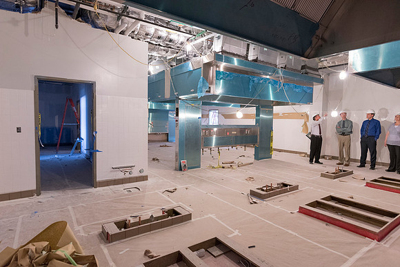 Faculty Members tour some of the kitchens located in the new science building while it is still under construction.