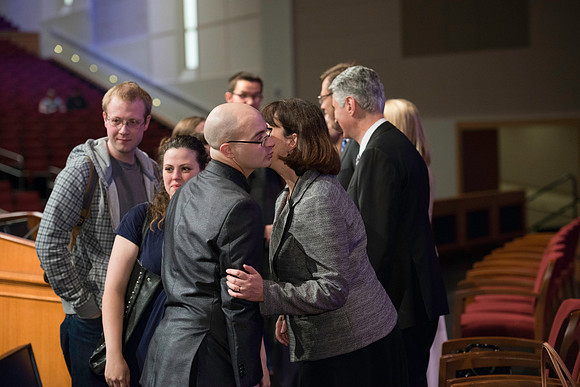 Bishop Gérald Caussé and his wife greet students after devotional.