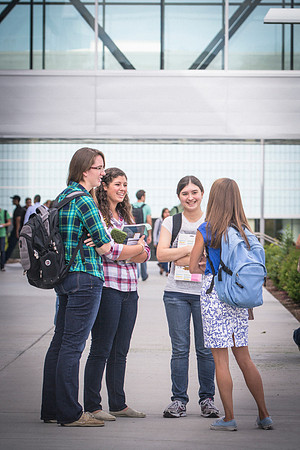 Students talk to each other outside the Manwaring Center on the first day of school