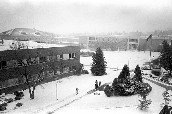 A view of the John L. Clarke Building on a snowy campus