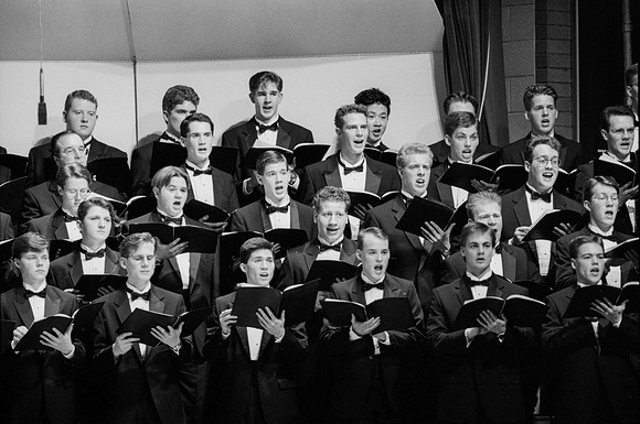 Sacred Music Series: Visions of Eternity. Choir members sing a piece for the performance. Performance held in the Hart Auditorium of Ricks College.