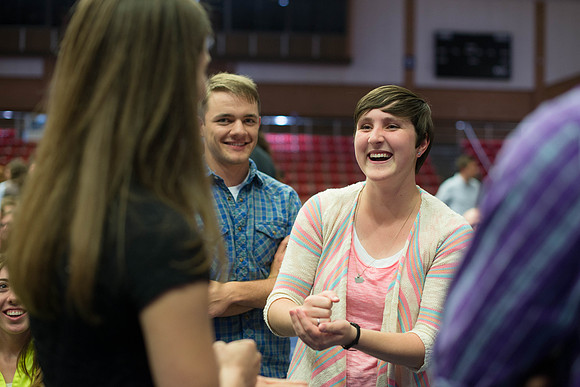 Students gather in the Hart auditorium for a date night with the Gilbert's.