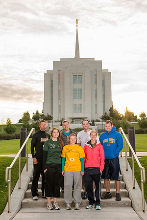 Team members pose by the Rexburg temple before they begin the temple to temple run