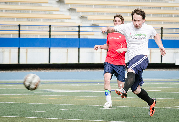 Students in Aimee Zimmer's Soccer class play outside in the Hart Stadium