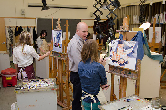 David Belka enthusiatically teaches painting principles to beginning painting class.