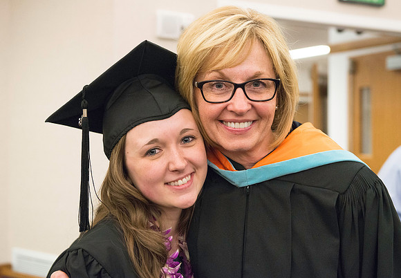 Teacher Education Department Chair Karla LaOrange and a student take a picture together.