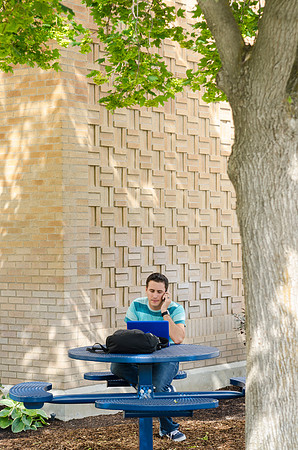 Student studying outside the Romney Building
