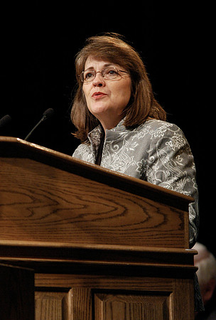 Sister Sue Clark speaking at a devotional.