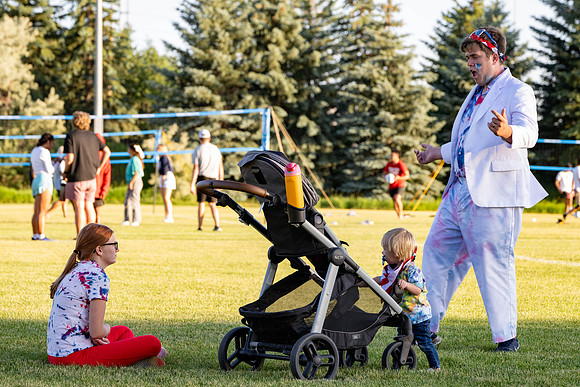 Students gather at the upper field for various 4th of July activities.