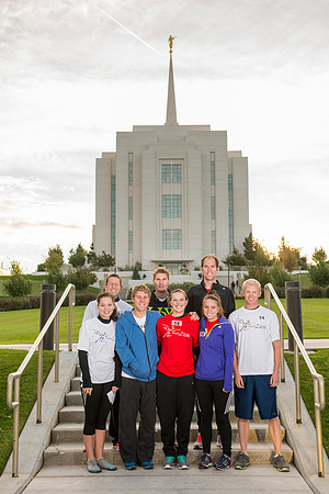 Team members pose by the Rexburg temple before they begin the temple to temple run