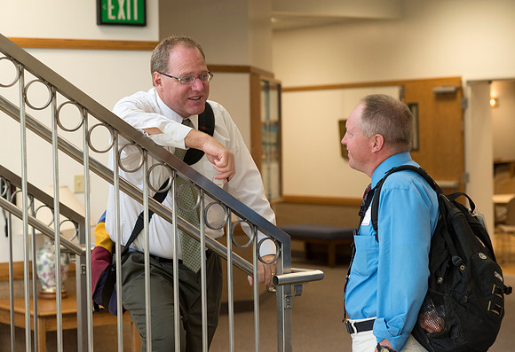 Faculty gather in the Hinckley Building at a Faculty Conference to share and learn from each other at the beginning of the 2013 Fall semester.