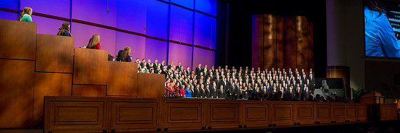 The combined men's and women's choir sing during Brother Joe Taylor's Devotional on Tuesday in preparation for their performance in the Saturday morning session of General Conference.