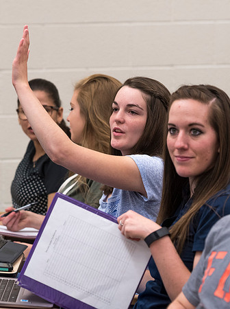 Students working with each other in the Foundations of the Restoration course on campus.