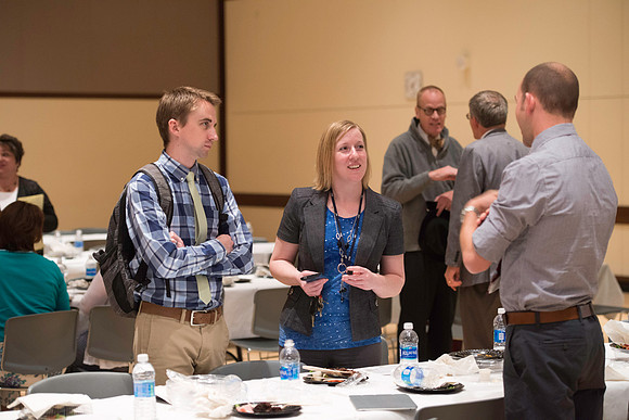 Faculty mingle after Dr. Maryellen Weimer addresses the faculty during a luncheon.