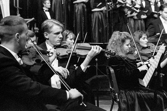 Members of the Orchestra performing a piece