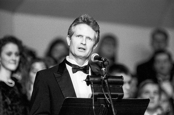 Member of the Orchestra addressing the audience