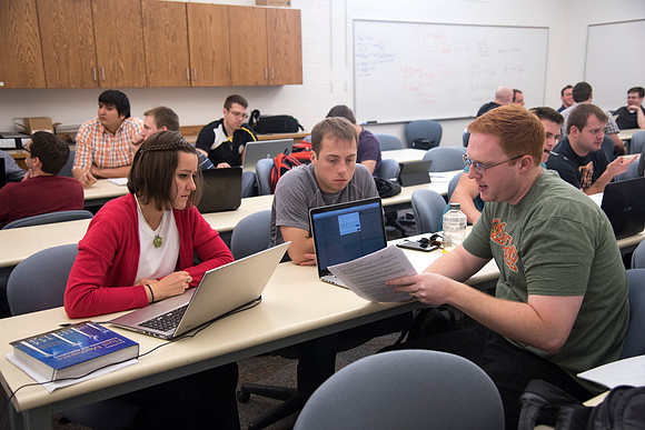 Mechanical Engineering students working together in the Fluid Mechanics course.