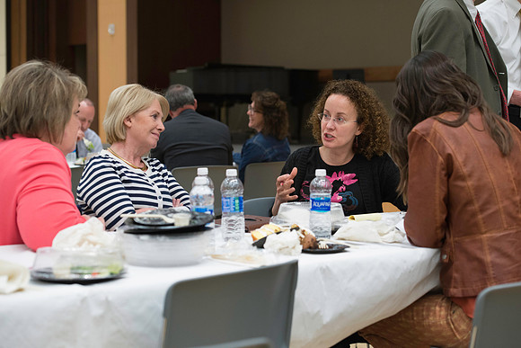 Faculty mingle after Dr. Maryellen Weimer addresses the faculty during a luncheon.