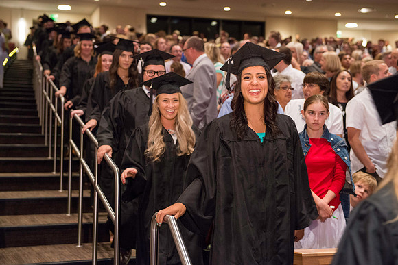 Graduates gather for BYU-Idaho commencement. Graduates march in during the processional.