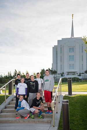 Team members pose by the Rexburg temple before they begin the temple to temple run