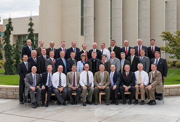 Group photo of the Religion Department in front of the Taylor Building.