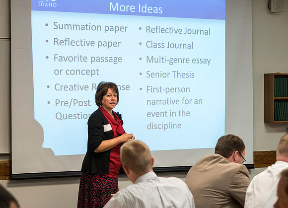 Faculty gather in the Hinckley Building at a Faculty Conference to share and learn from each other at the beginning of the 2013 Fall semester.