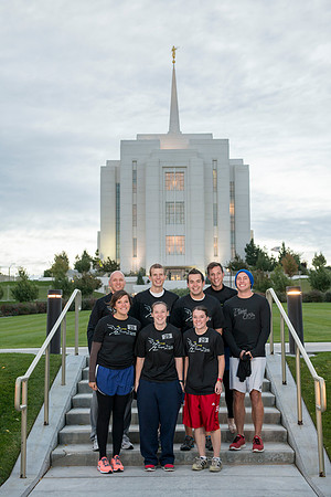 Team members pose by the Rexburg temple before they begin the temple to temple run