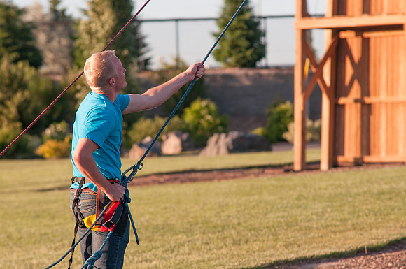 Student(s) belaying while other students climb ropes course, Spring 2013