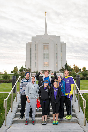Team members pose by the Rexburg temple before they begin the temple to temple run