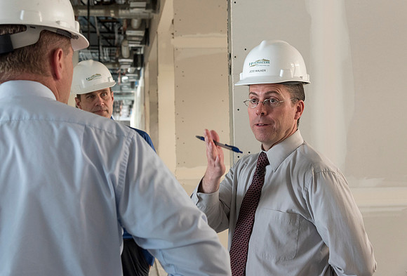 Faculty Members tour the new science building while it is still under construction.
