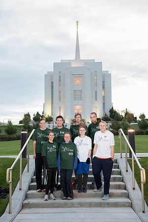 Team members pose by the Rexburg temple before they begin the temple to temple run