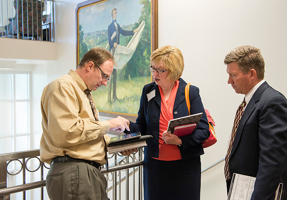 Faculty gather in the Hinckley Building at a Faculty Conference to share and learn from each other at the beginning of the 2013 Fall semester.