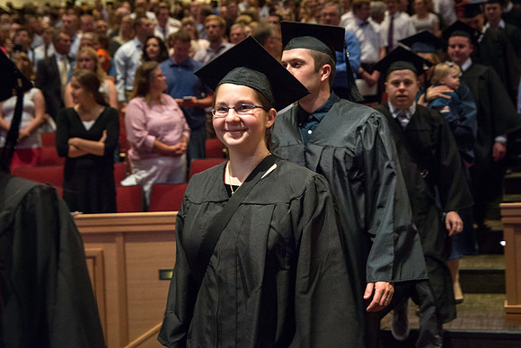 Graduates walking into the BYU-Idaho Center for the Processional march.