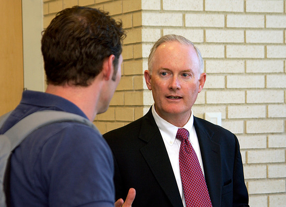 President Clark speaks with student after University Forum.