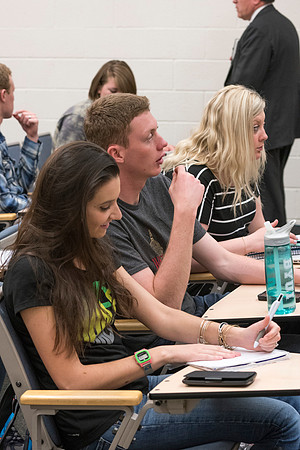 Students working with each other in the Foundations of the Restoration course on campus.