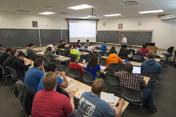 Brother Johanson answers a student's question during his Math 109 Precalculus class during the 2014 Spring Semester.