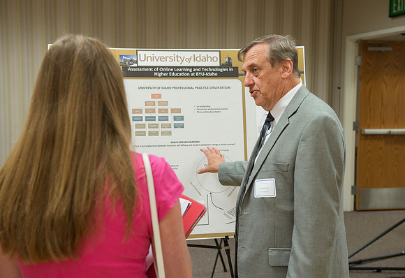 Faculty gather in the Hinckley Building at a Faculty Conference to share and learn from each other at the beginning of the 2013 Fall semester.