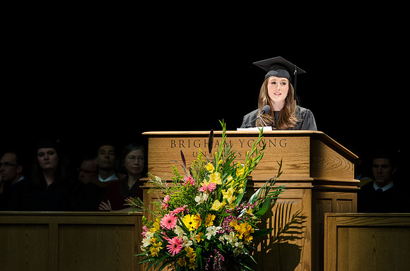 Hannah J. Thompson, a communications major, speaks during Convocation held in the Hart Auditorium during the 2014 Winter Semster Graduation.