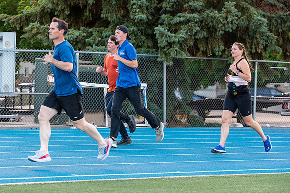 Faculty and community members of BYUI at Speed and Agility triathlete trannings at the stadium.