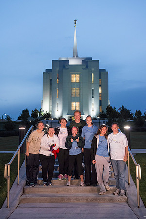 Team members pose by the Rexburg temple before they begin the temple to temple run