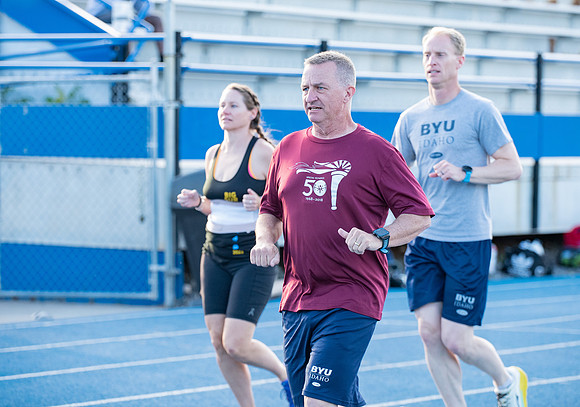 Faculty and community members of BYUI at Speed and Agility triathlete trannings at the stadium.