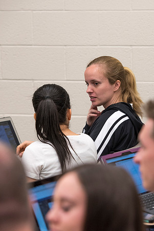 Students working with each other in the Foundations of the Restoration course on campus.